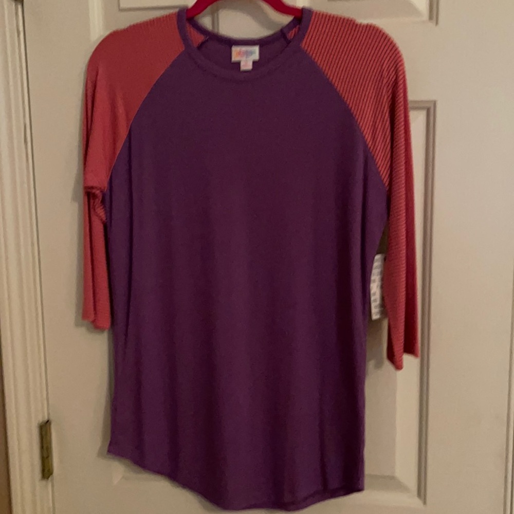 NWT LuLaRoe Randy top in a pink and purple color.